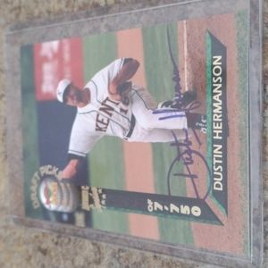 Dustin Hermanson autographed baseball card in protective cover.